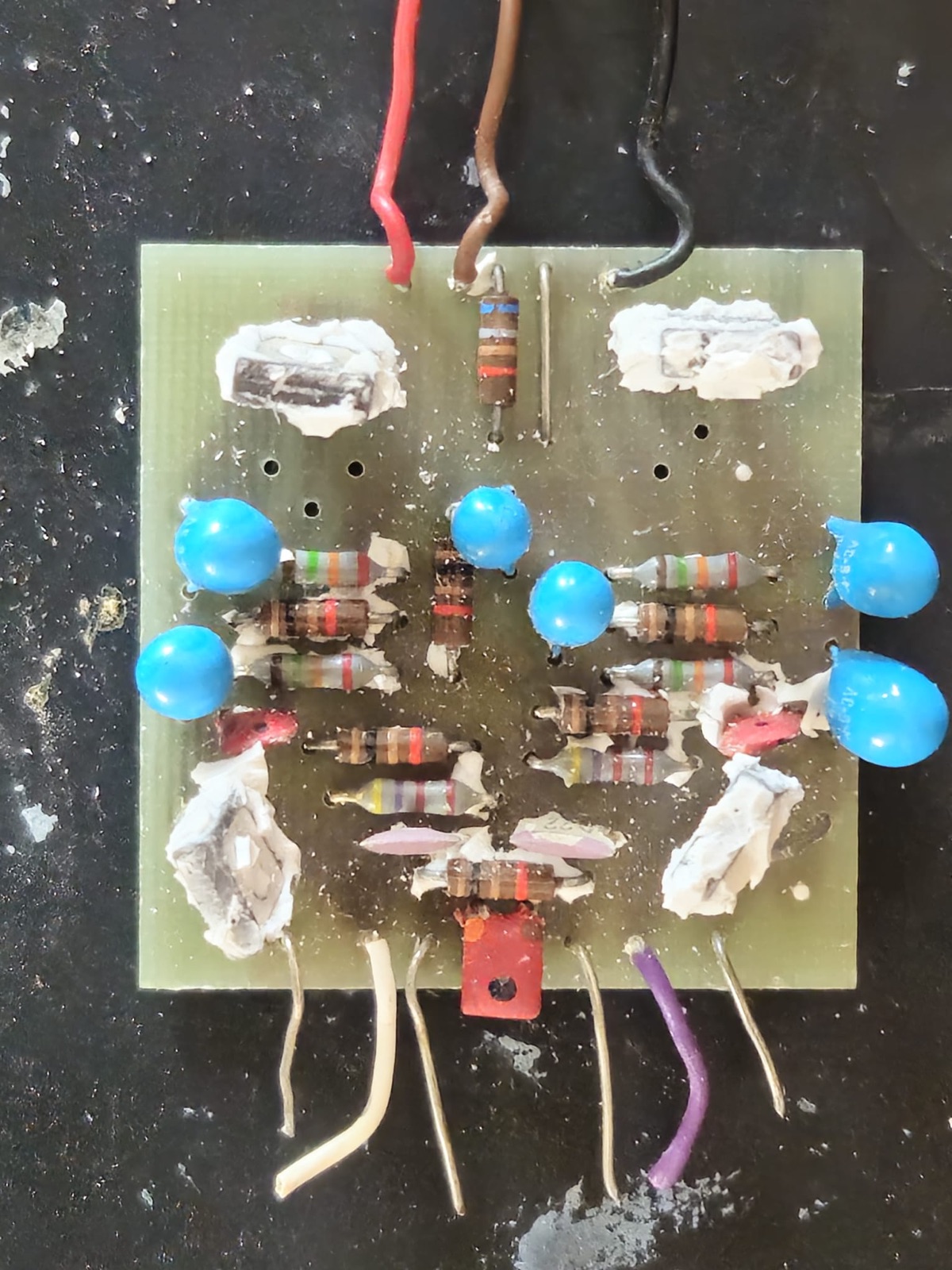 The Lentek head amp circuit board after the silicone potting was removed, blue tantalum capacitors and original resistors in place