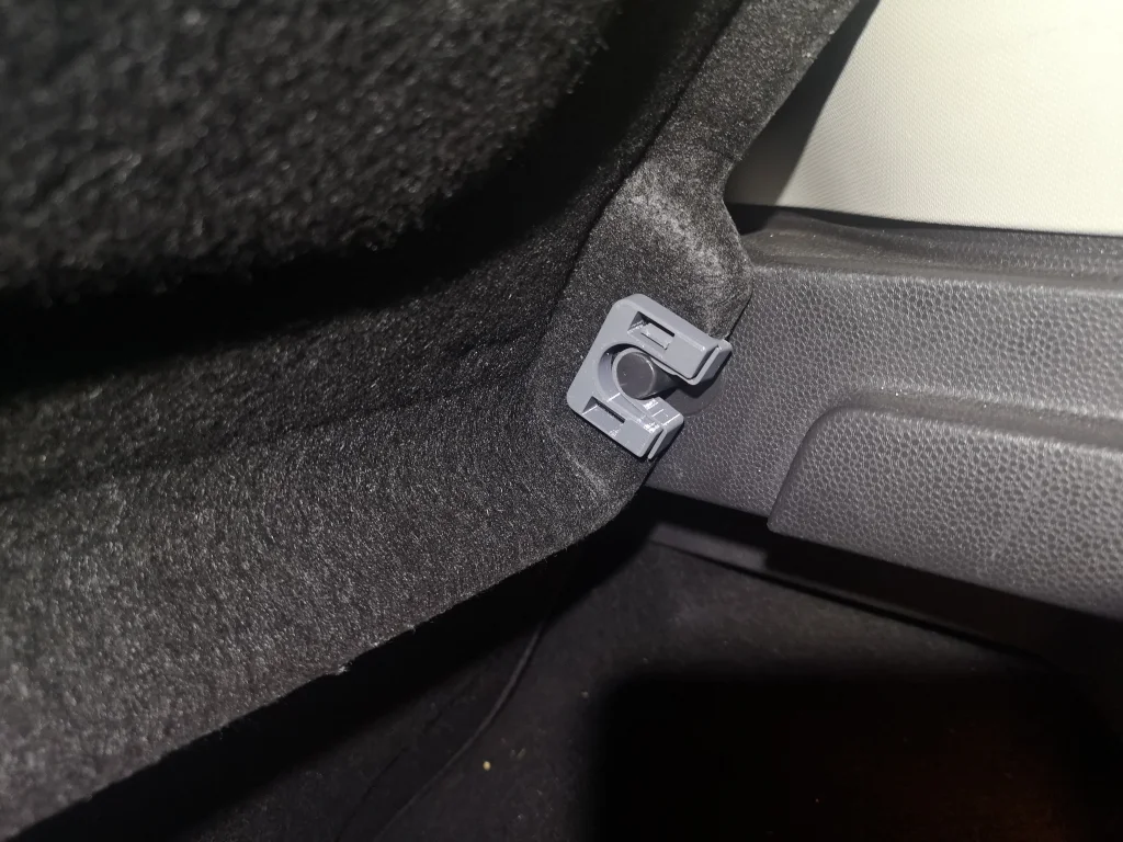 A printed parcel shelf clip fitted in a car