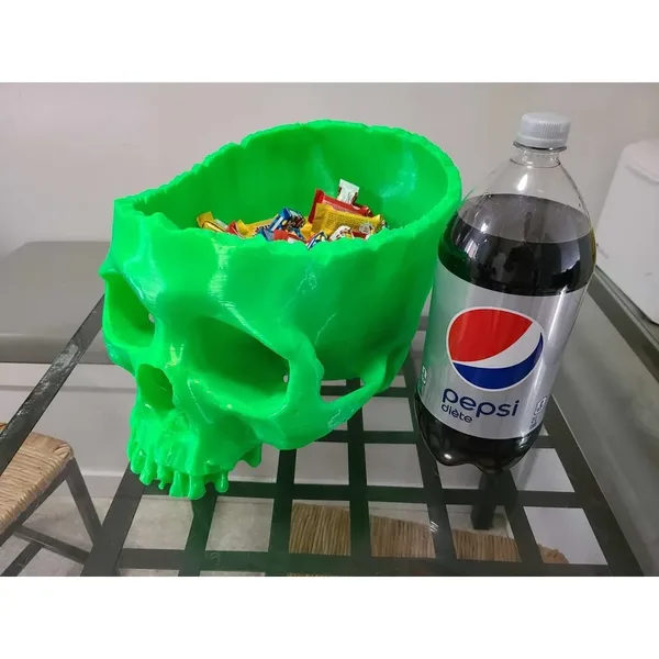 Green 3D printed skull-shaped bowl for wrapped Halloween treats