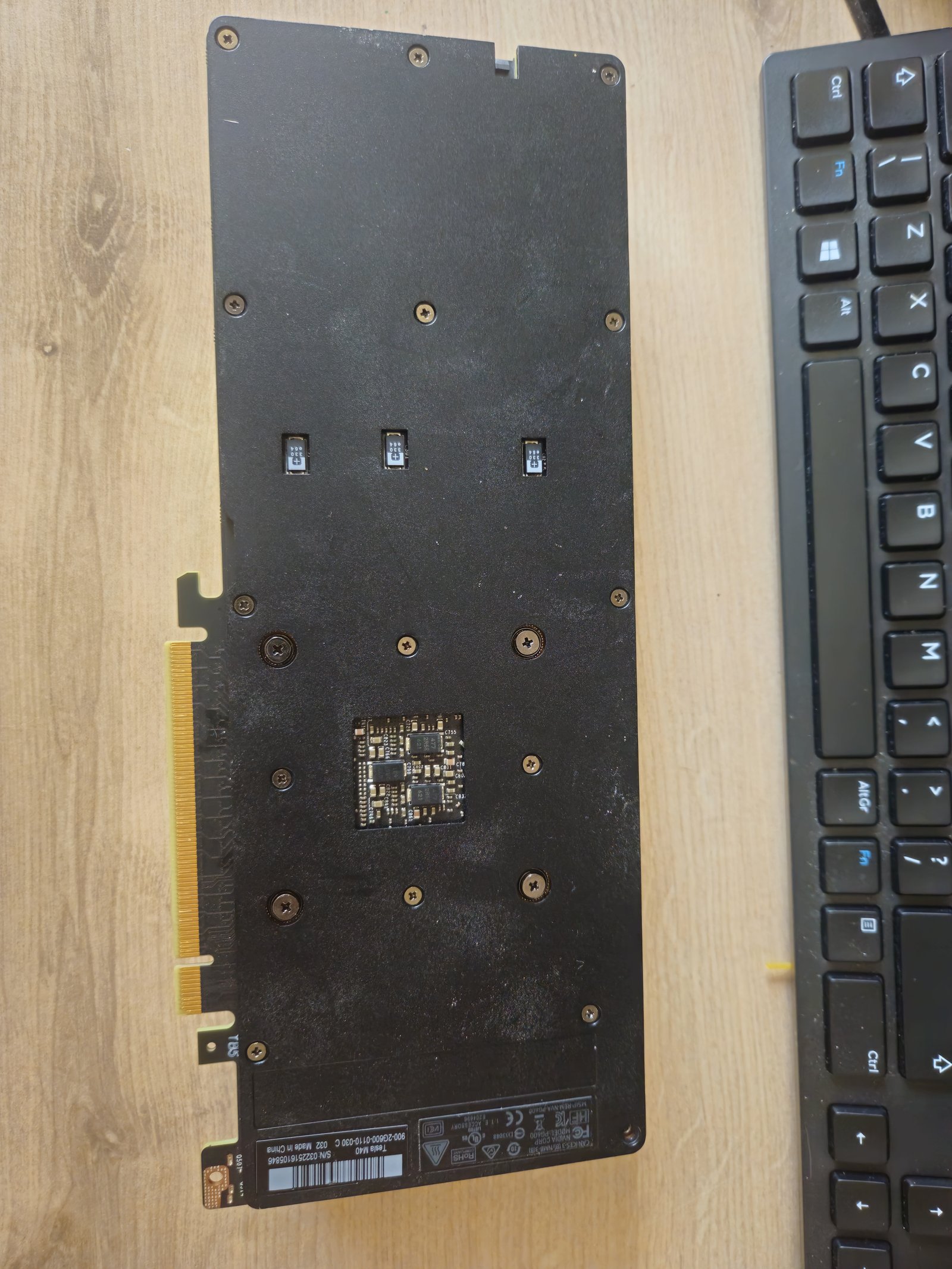 Back of the card before disassembly, showing the auxiliary regulator board