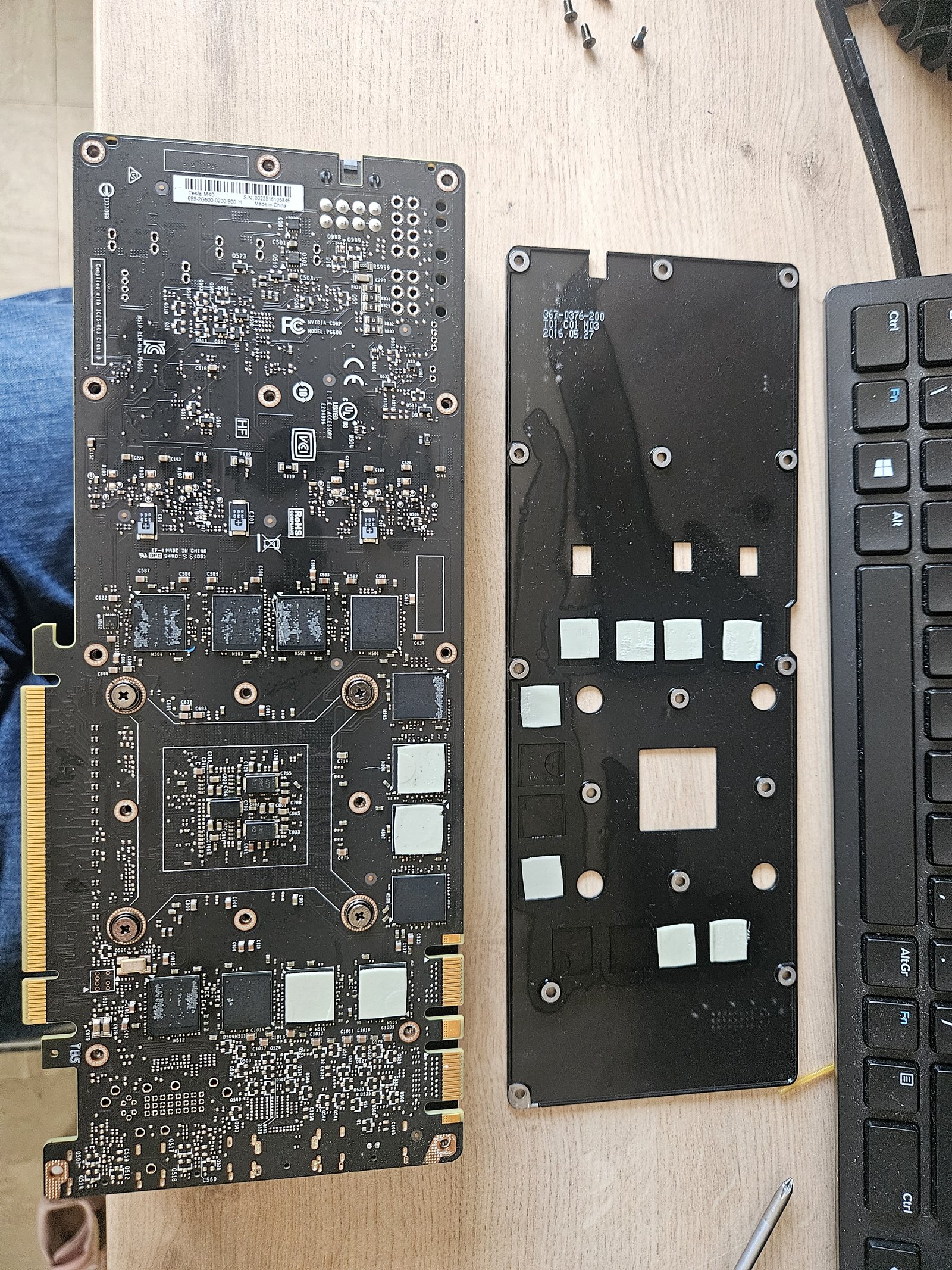 Cooler separated from the PCB — old thermal pads still attached to the cold plate