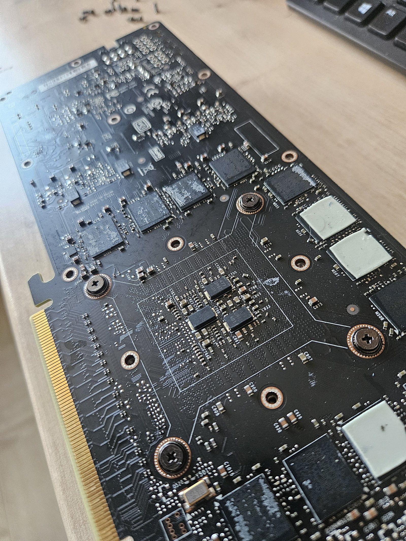 Reassembly — back of the PCB with the auxiliary regulator board refitted