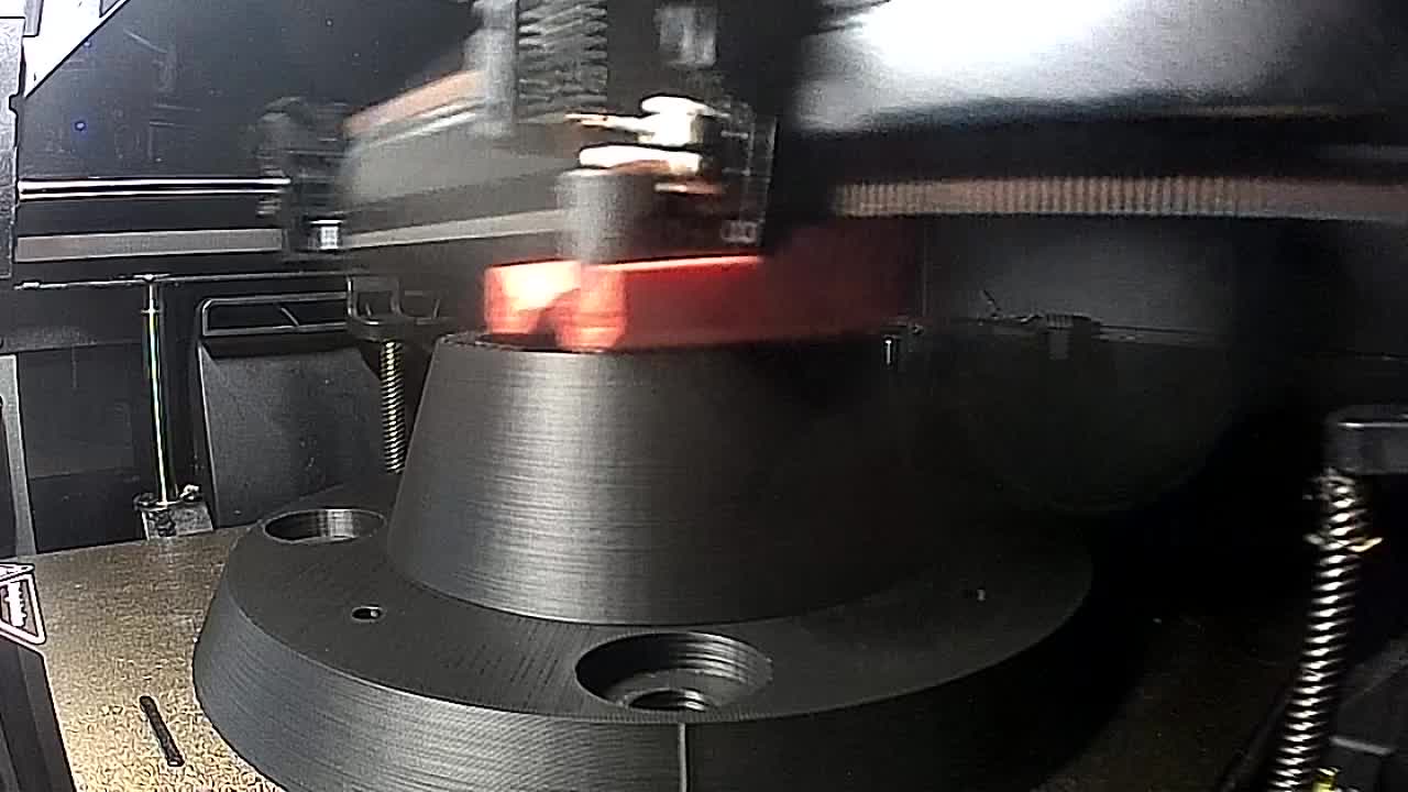A large black component being printed