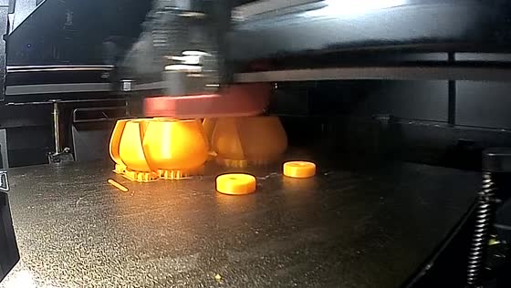 Orange components on a printer bed