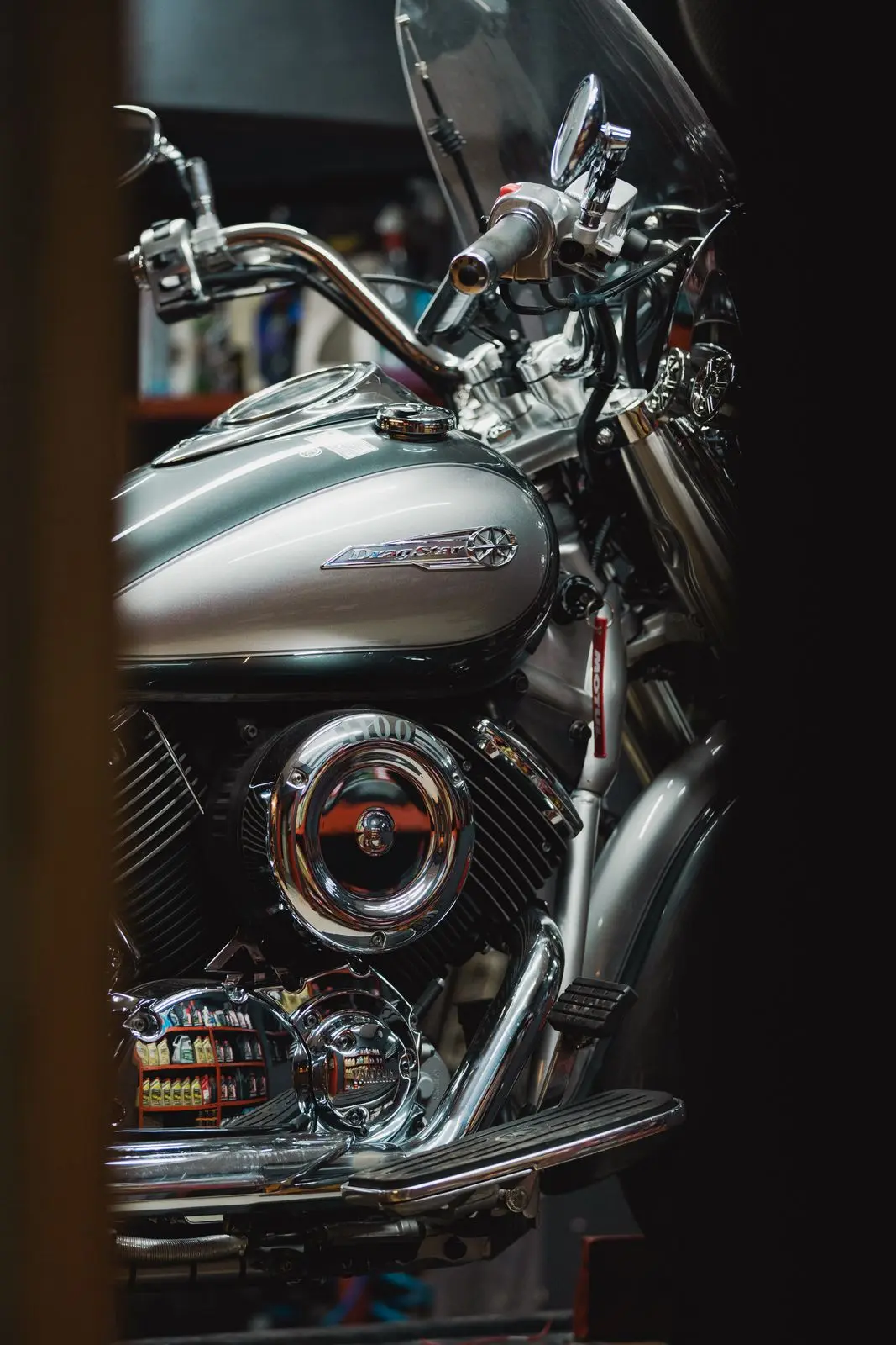 Close-up of a classic motorcycle engine, fuel tank and handlebars