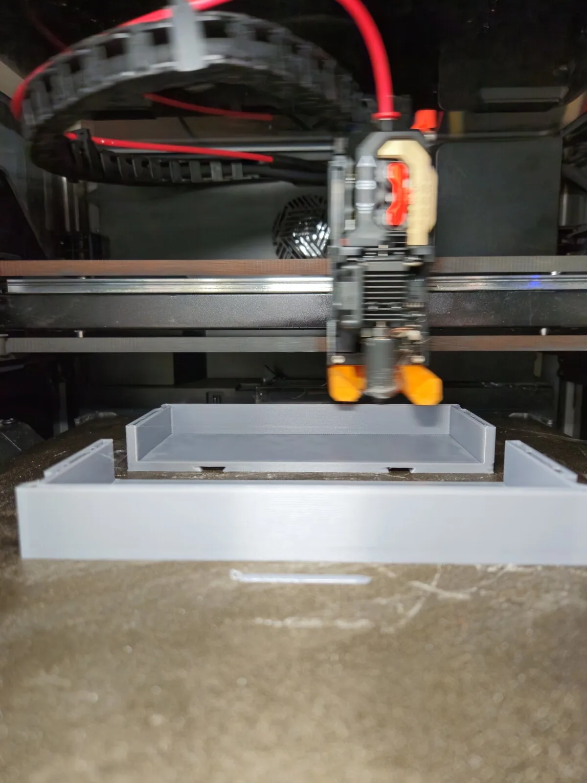 3D printer producing a part in the Hark Tech workshop