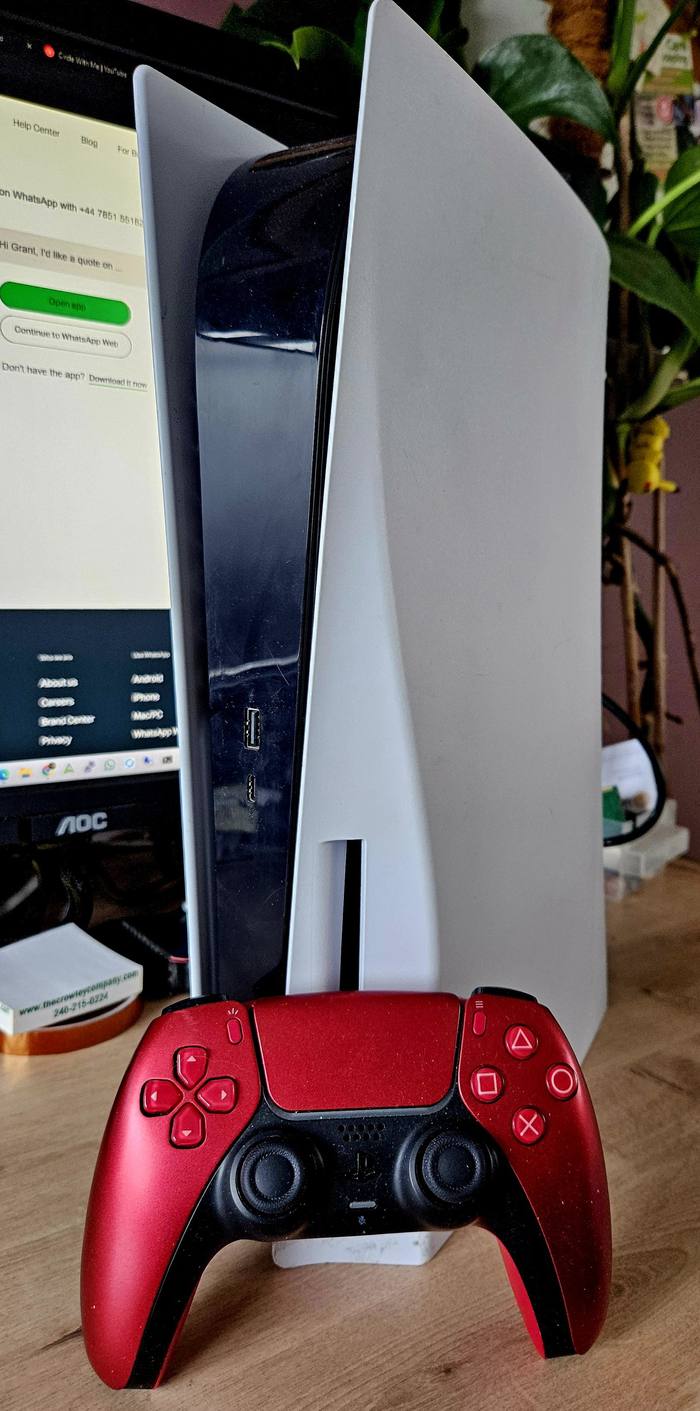 Sony PlayStation 5 console with DualSense controller on the workshop bench