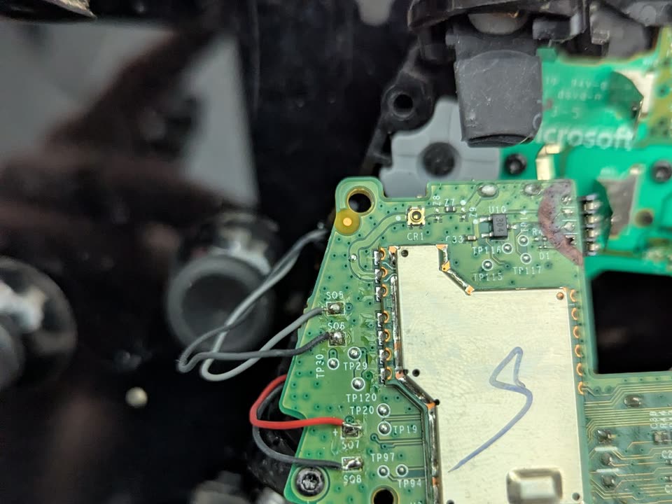 Game controller on the repair bench, mid-diagnostic