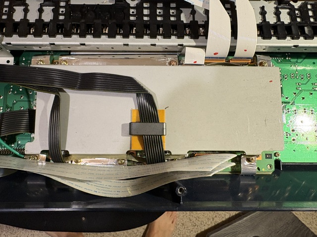 Original customer photograph showing the shielded main board and ribbon cables inside the synthesiser