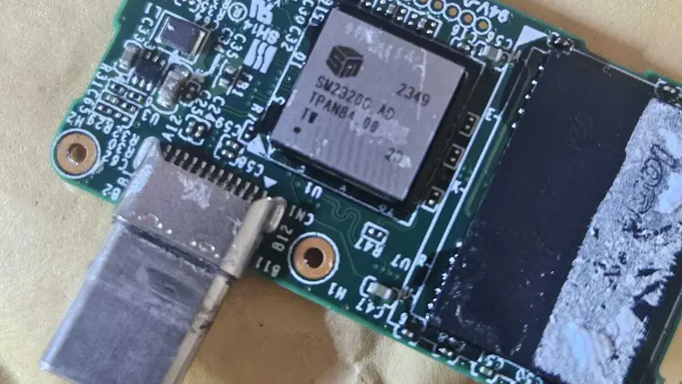 A Lexar Go SSD circuit board with its bent USB-C plug