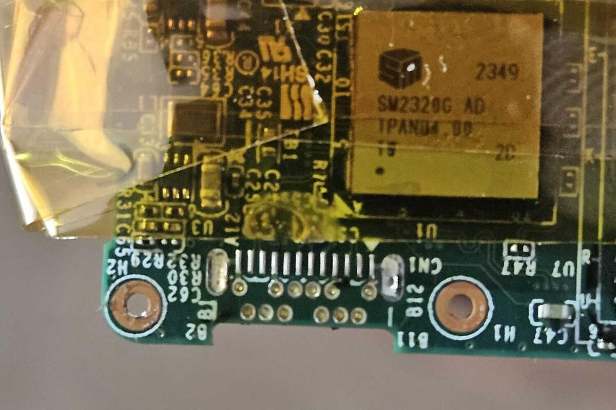 The Lexar Go board with the USB-C plug removed, showing one row of surface-mount pads and two staggered rows of through-holes