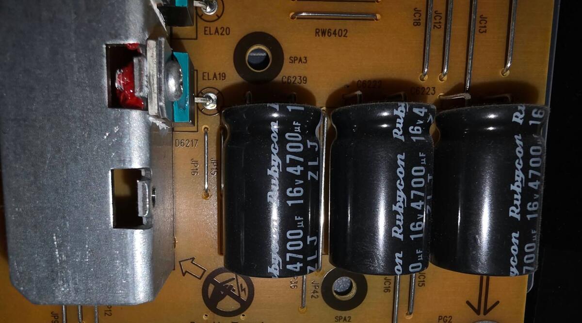 The large smoothing capacitors on the low-voltage side of the Sony power board, with no bulging or leaking